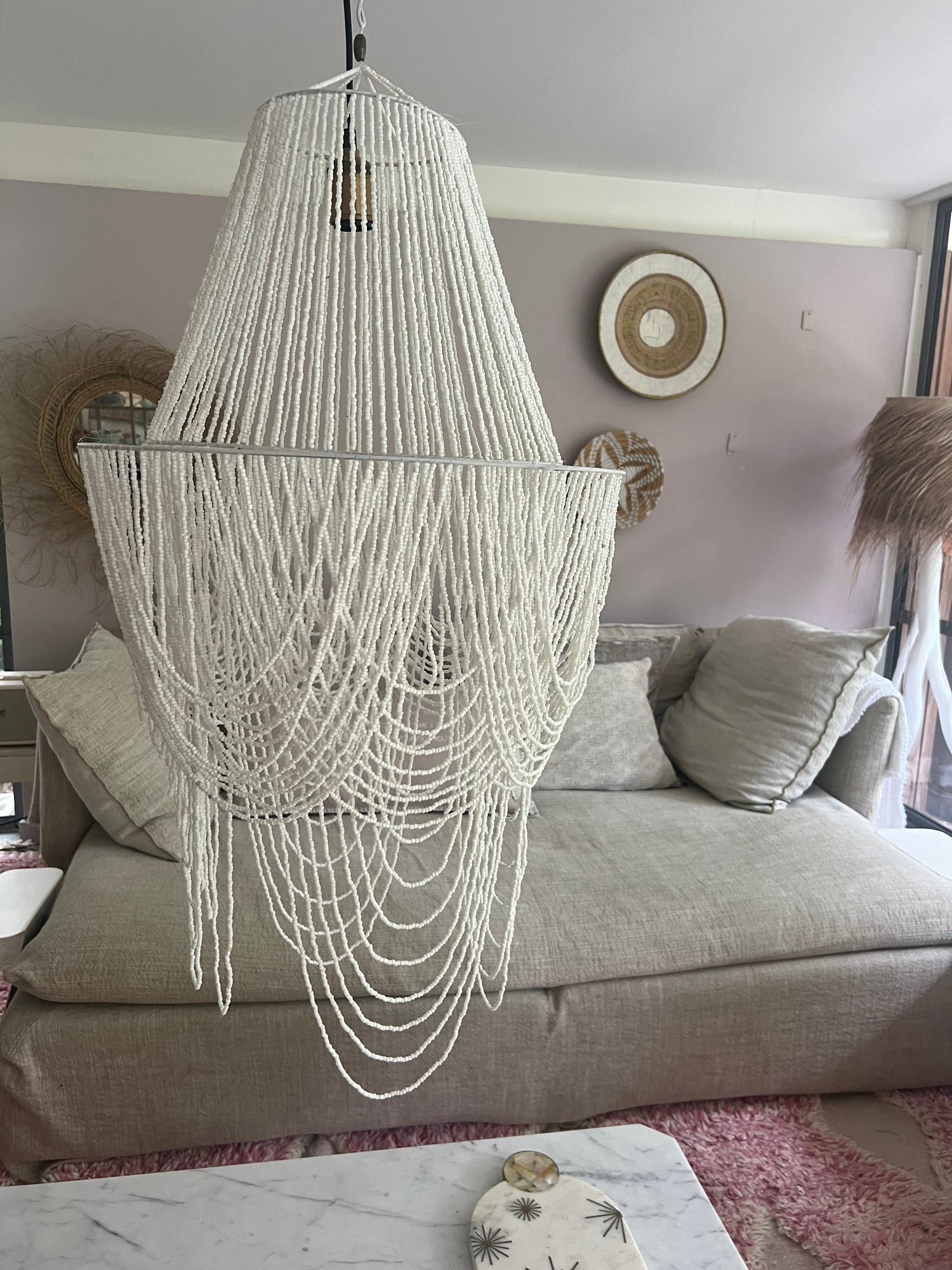 Handcrafted white beaded lamps.