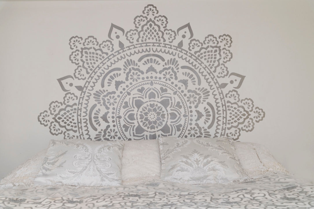 Silver mandala behind my bed.