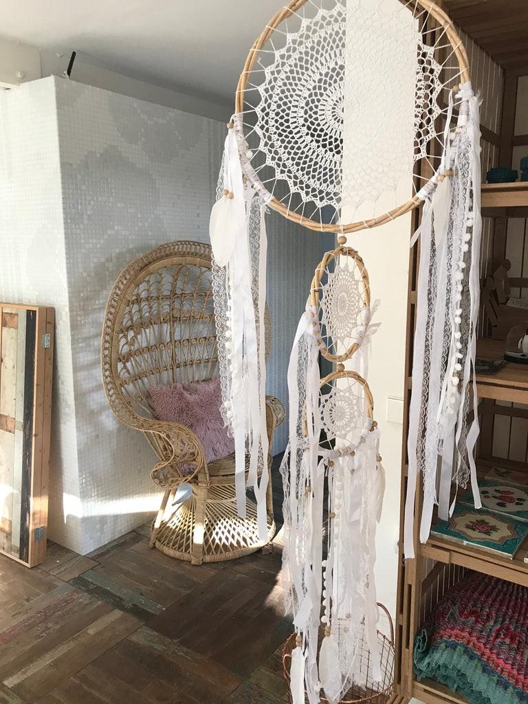 Three-tier dreamcatcher with intricate white lace patterns, wooden rings, and long white fabric tassels, 32cm size.